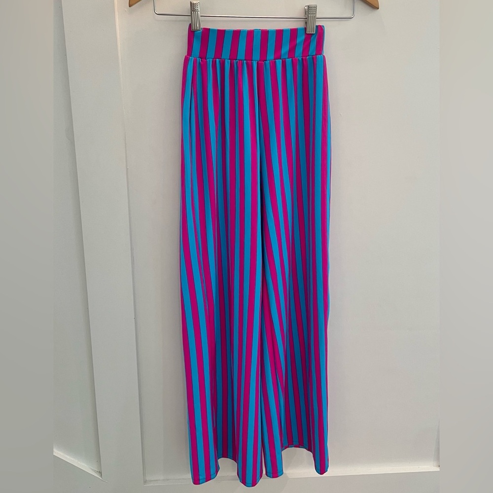 Striped pink & blue pants with black gauze overlay top.